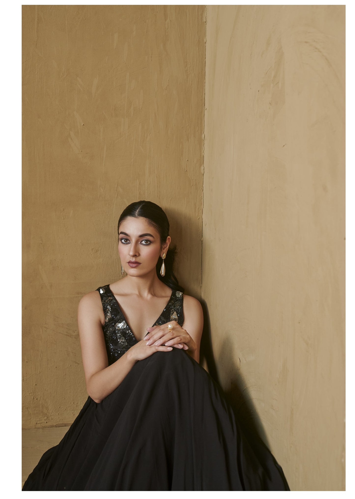 Black beaded bustier with pleated jacket set.