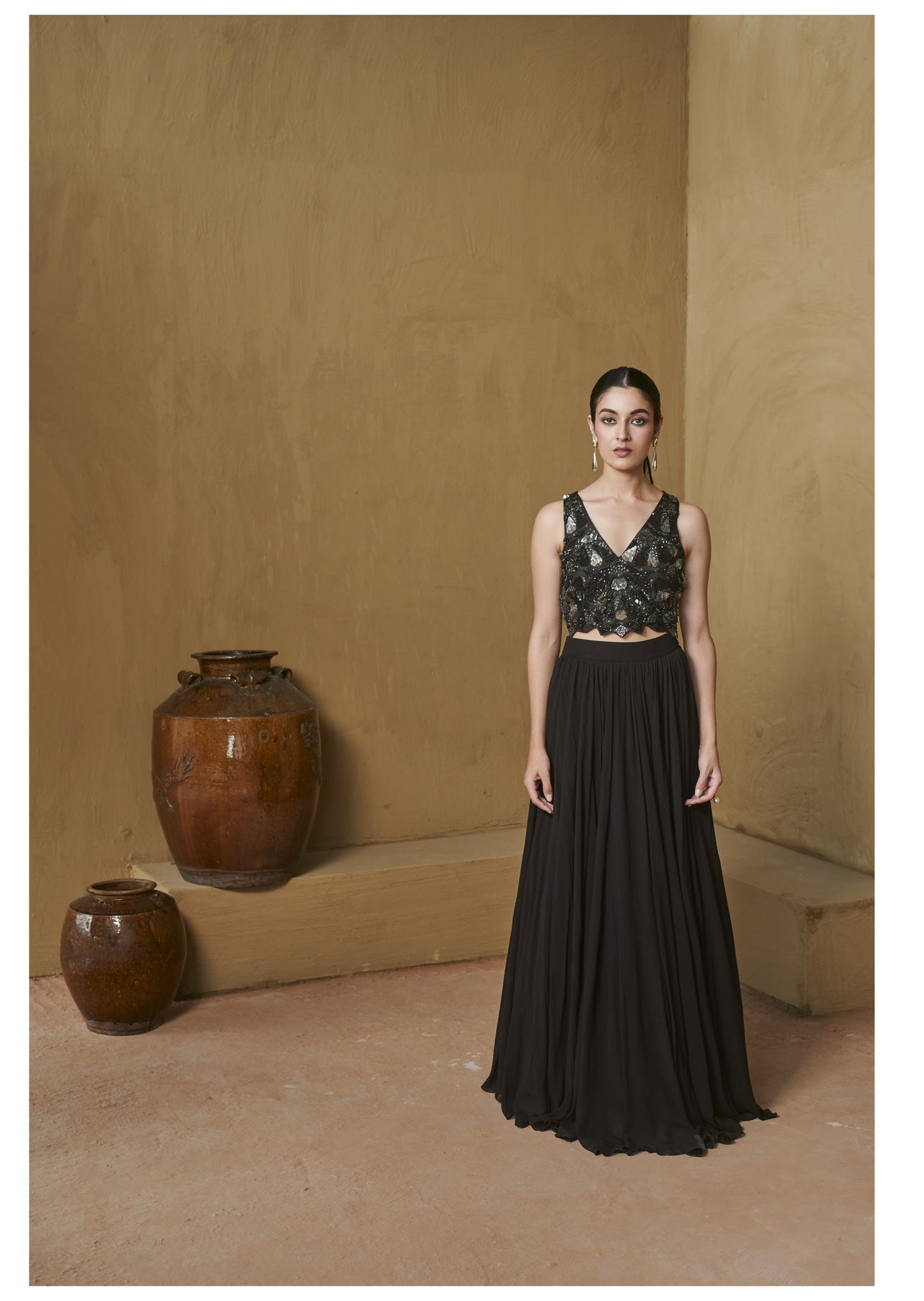 Black beaded bustier with pleated jacket set.