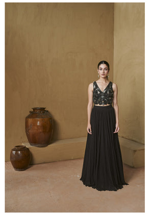 Black beaded bustier with pleated jacket set.