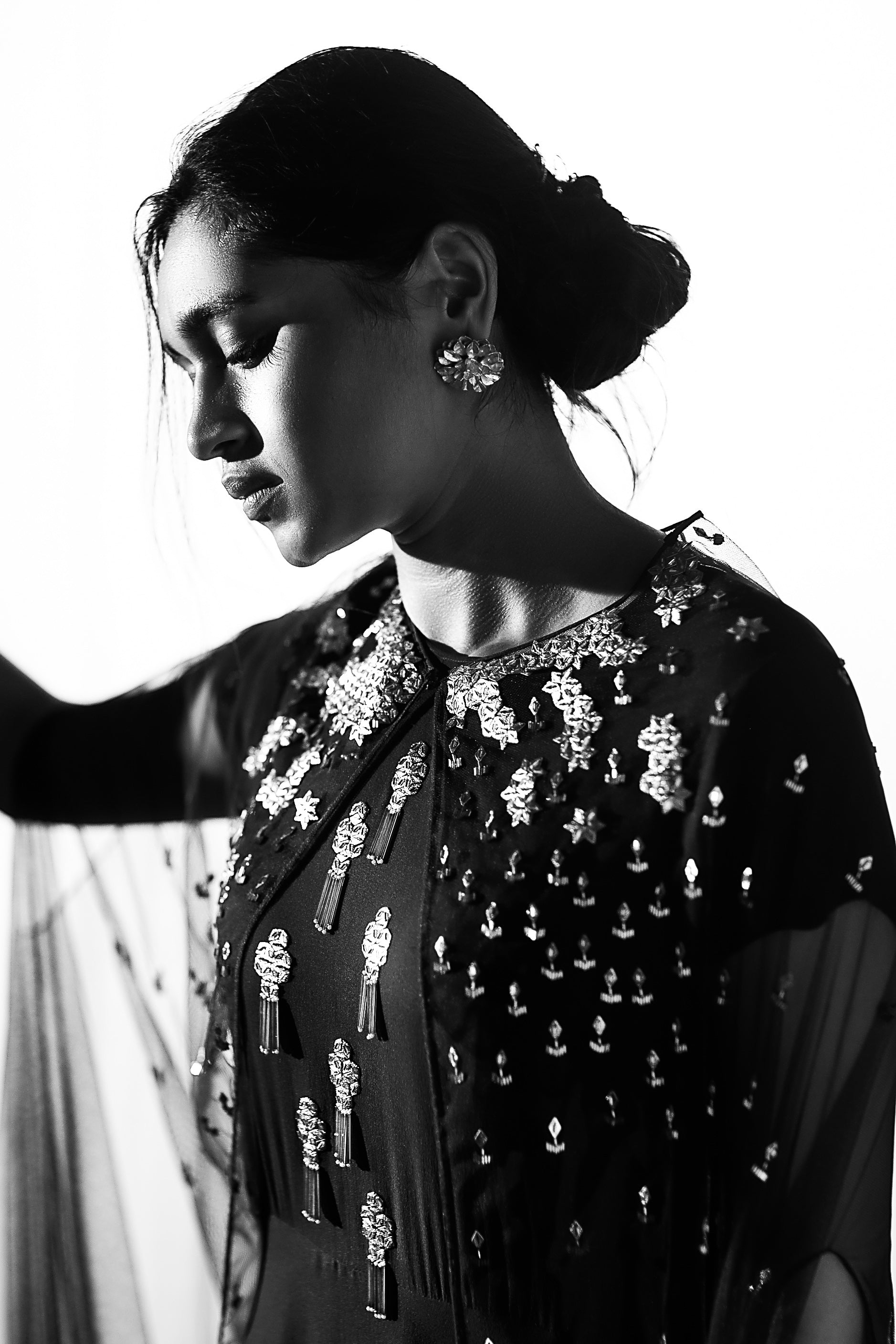 Maroon gown with embroidered net cape